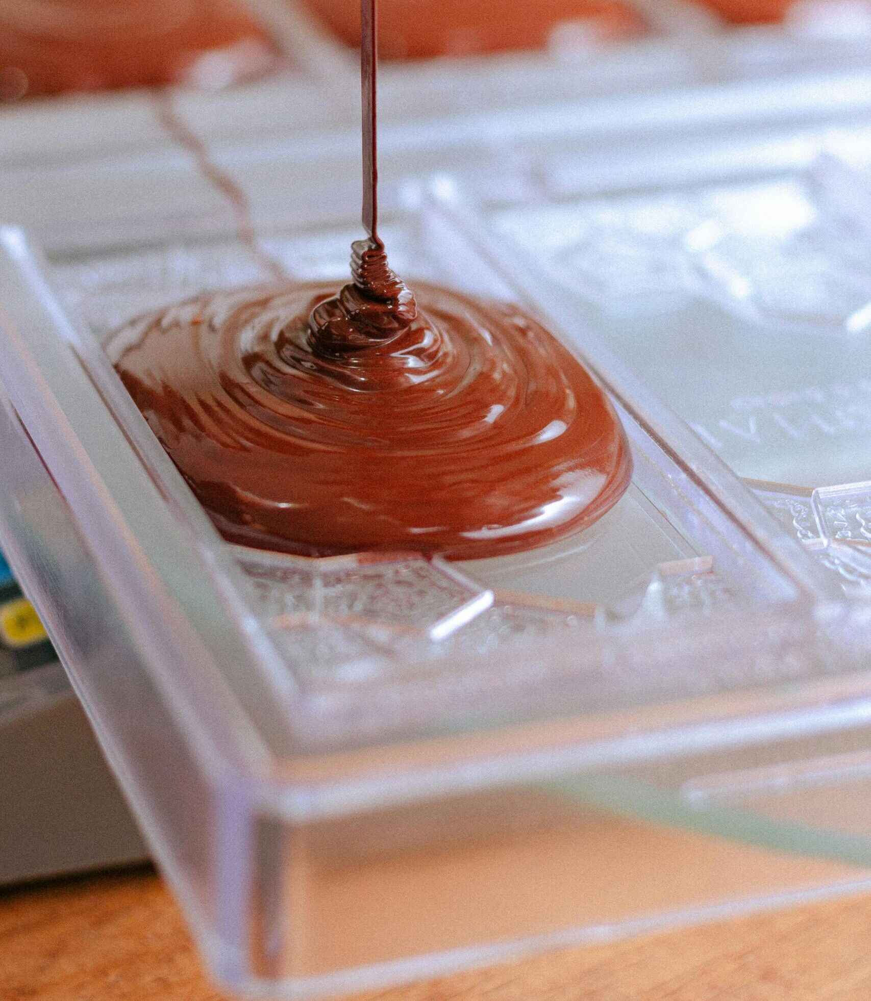 Close-up shot of artisanal chocolate being poured into a mold, Chiapas, México.