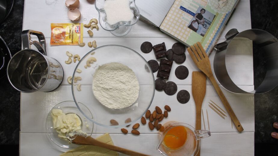 Aerial view of baking ingredients and tools ready for cooking.